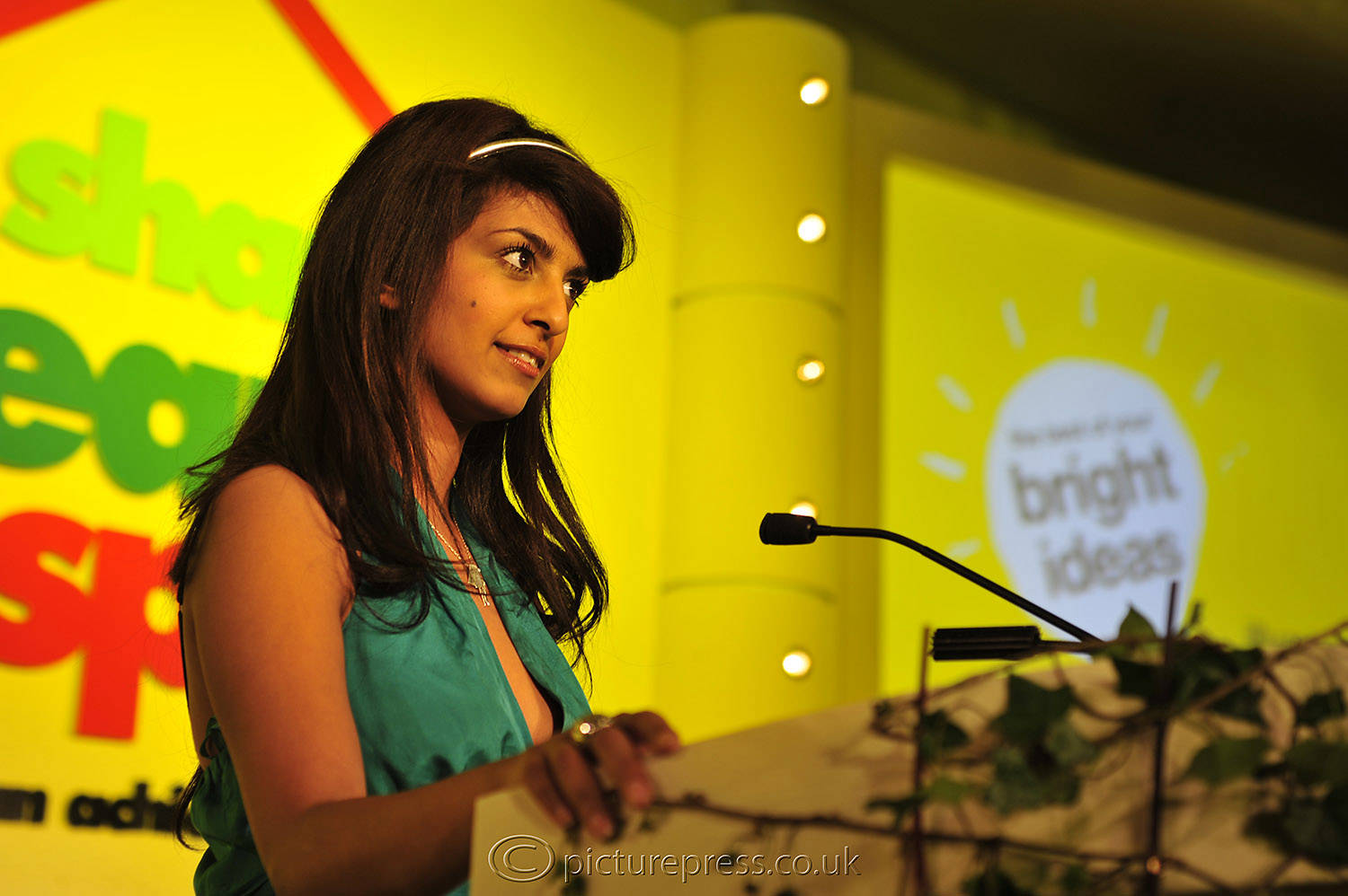Konnie Huq presenter on stage at direct marketing conference.
