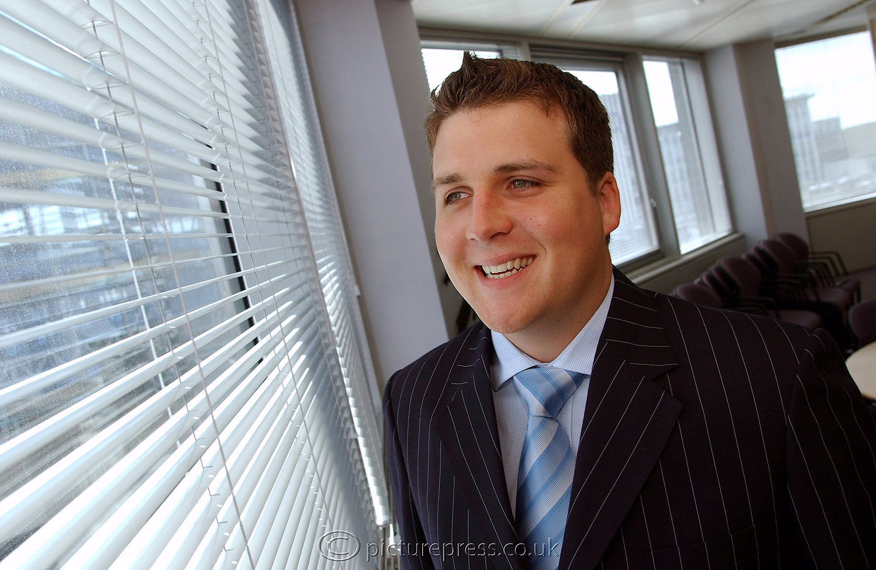 business male executive  headshot in office environment taken for web site use by photographer mike kelly picturepress birmingham