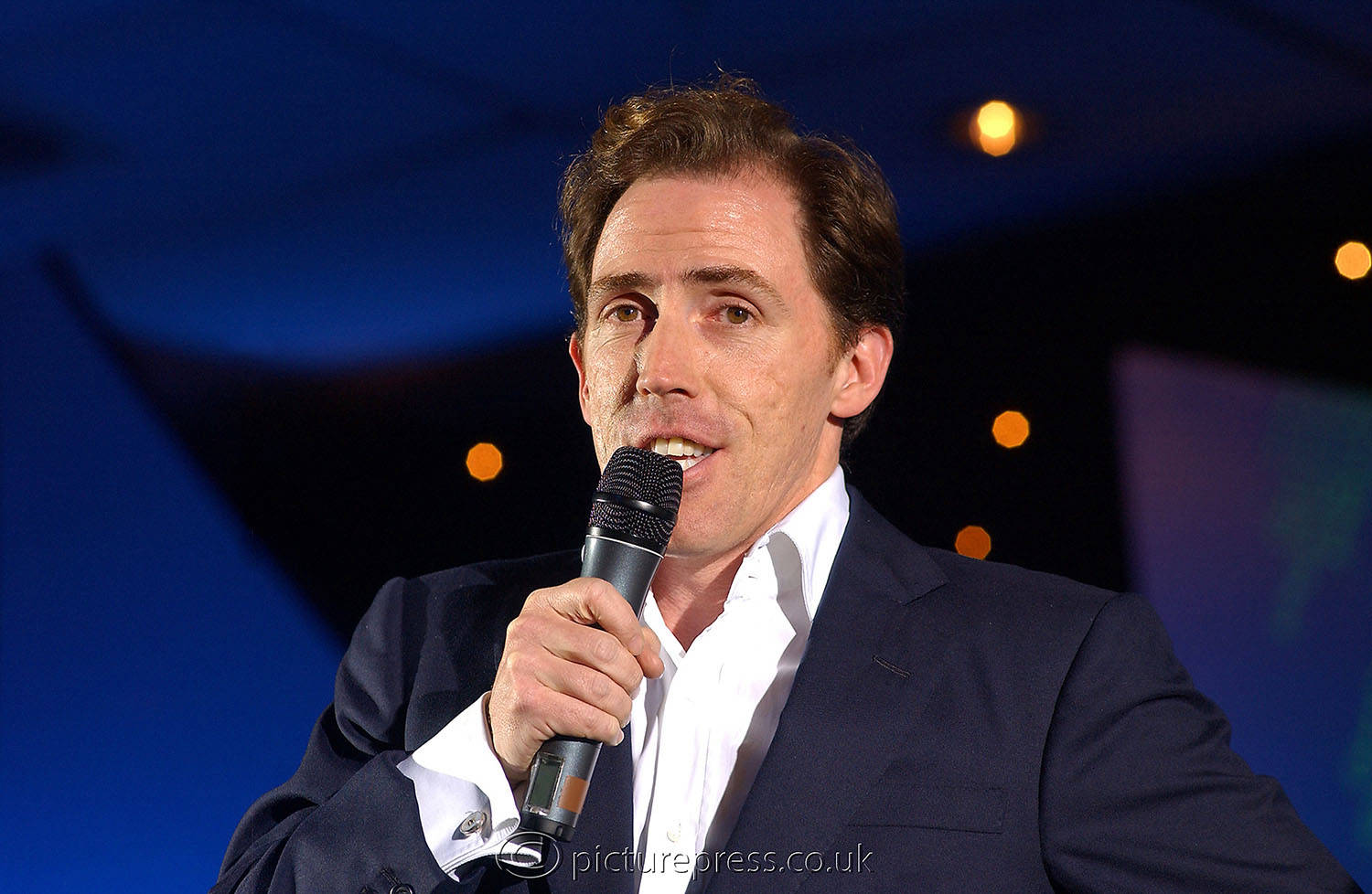 rob brydon comedian performing on stage at SAP event conference  in london. image taken for press release