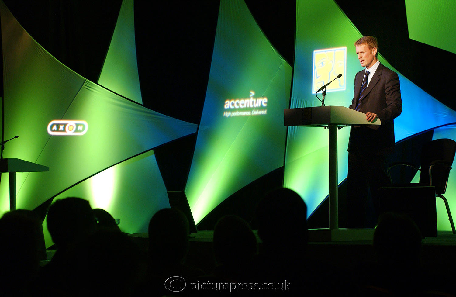 speaker on presenting on stage at a conference event in coventry