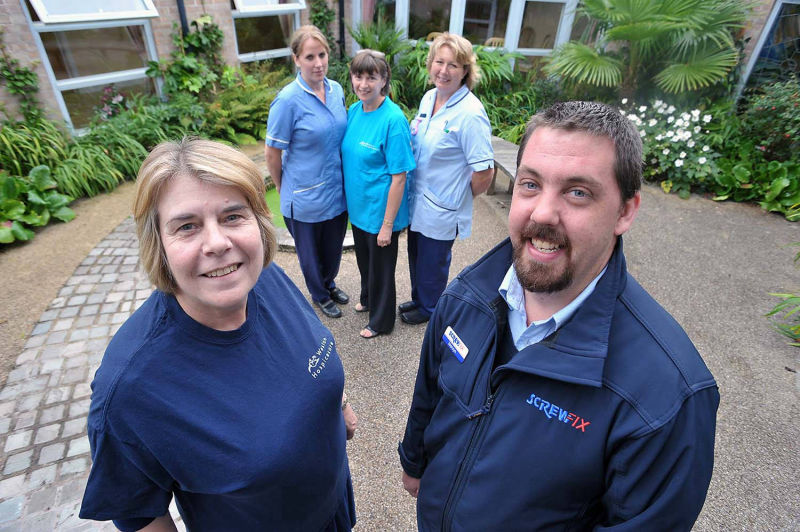 group of people with screwfix staff at pr event in weston super mare image taken for magazine article. by mike kelly  photographer at picturepress birmingham.