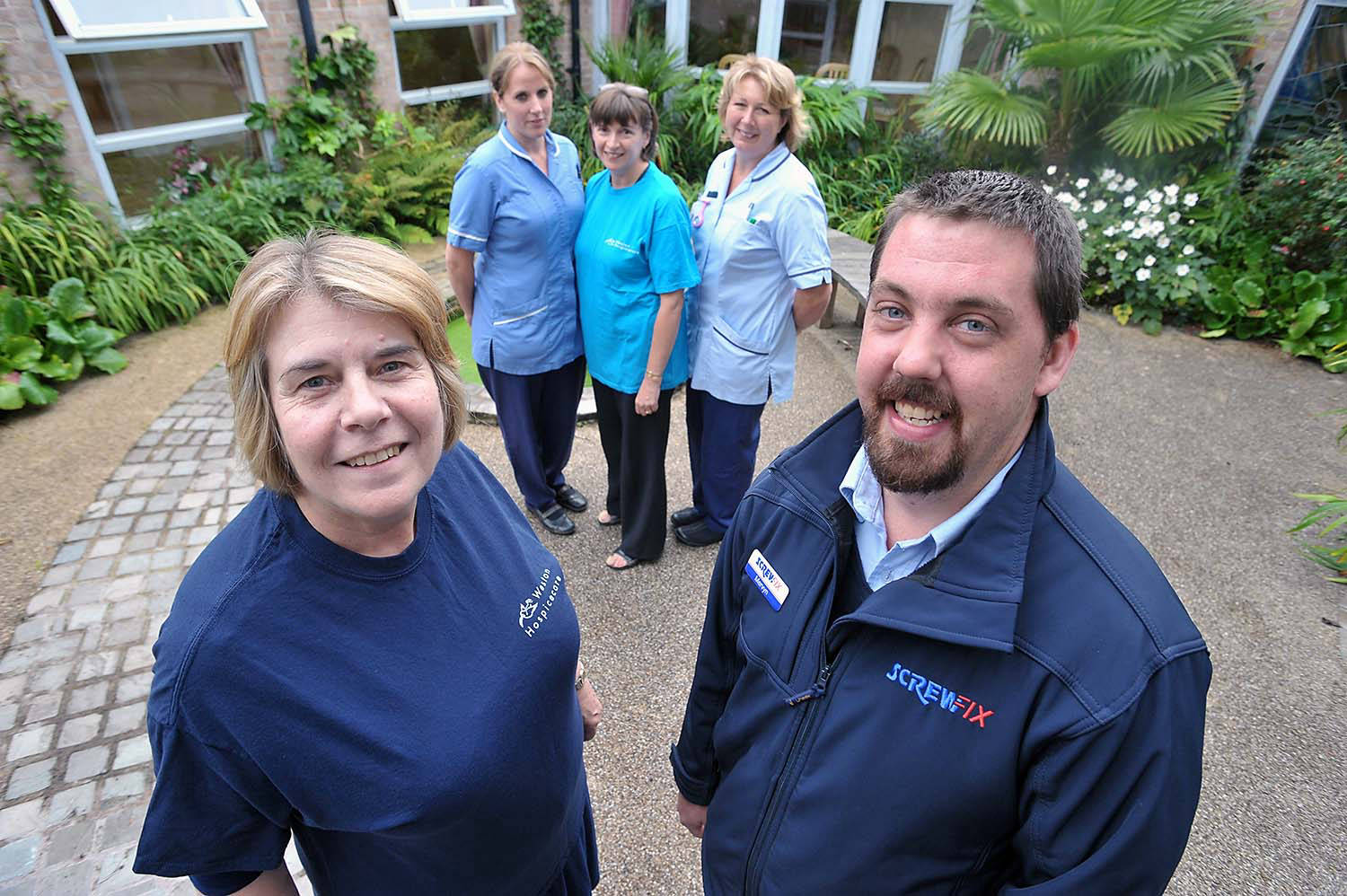group of people with screwfix staff at pr event in weston super mare image taken for magazine article. by mike kelly  photographer at picturepress birmingham.