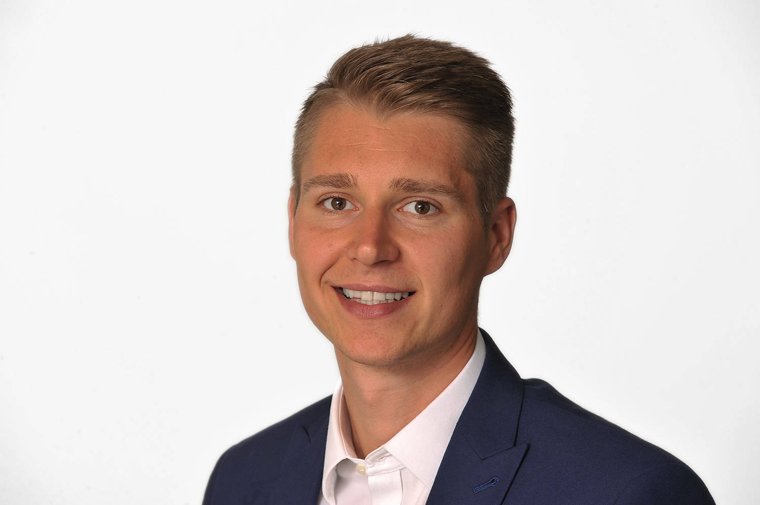 studio portrait of business man in office